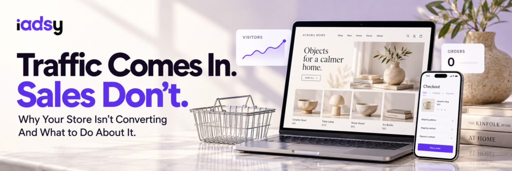 Online store on a laptop and phone beside an empty shopping basket, illustrating traffic without sales.